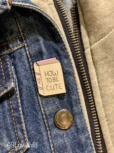 "How to be Cute" book pin